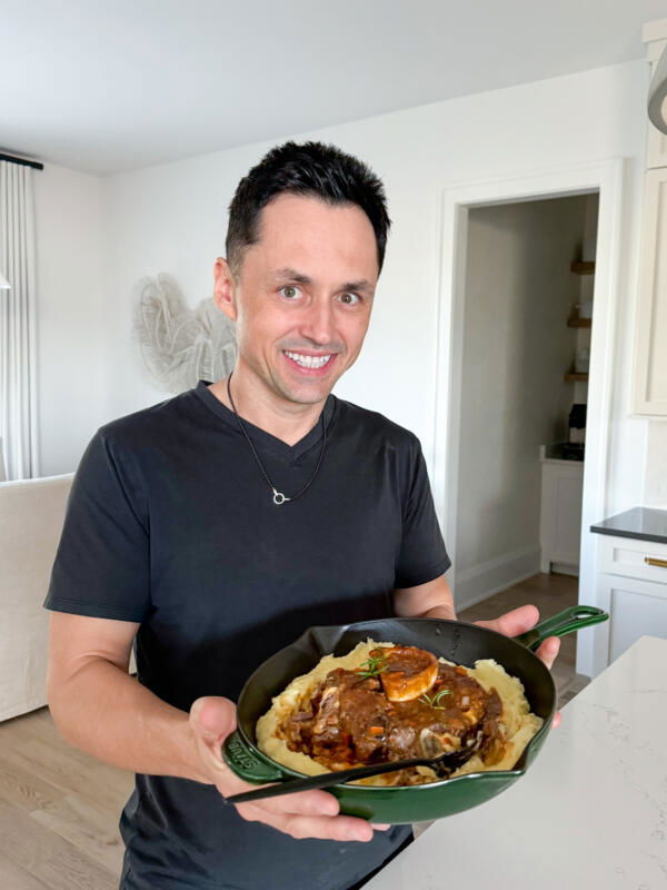 Tim with a serving plate of Osso Buco.