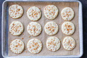 Butter Toffee Cookies baked on a baking sheet.