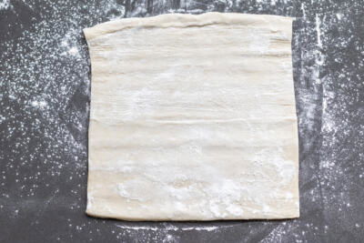 Rolled out floured puffed pastry.