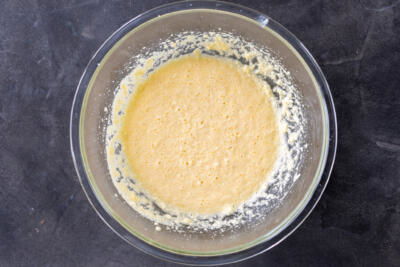 Egg butter and sugar in a bowl.