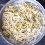Cottage Cheese Alfredo in a pan with herbs.