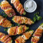 Sering tray Bacon Wrapped Jalapeño Poppers.