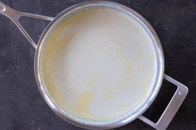 Alfredo sauce in a pan.