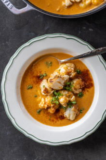 Creamy Lobster Bisque with more lobster on top.