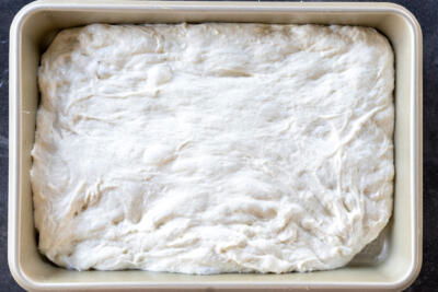 Bubbly dough in a pan.