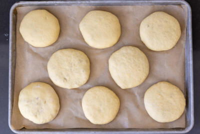 Bierocks before baking on a baking sheet.