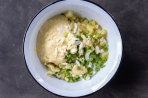 All the salad ingredients in a bowl.