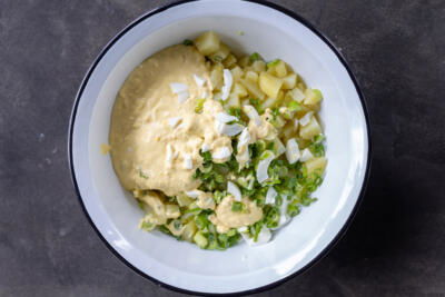 All the salad ingredients in a bowl.