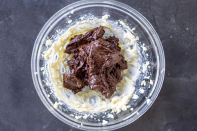 Chocolate added to whipped cream.