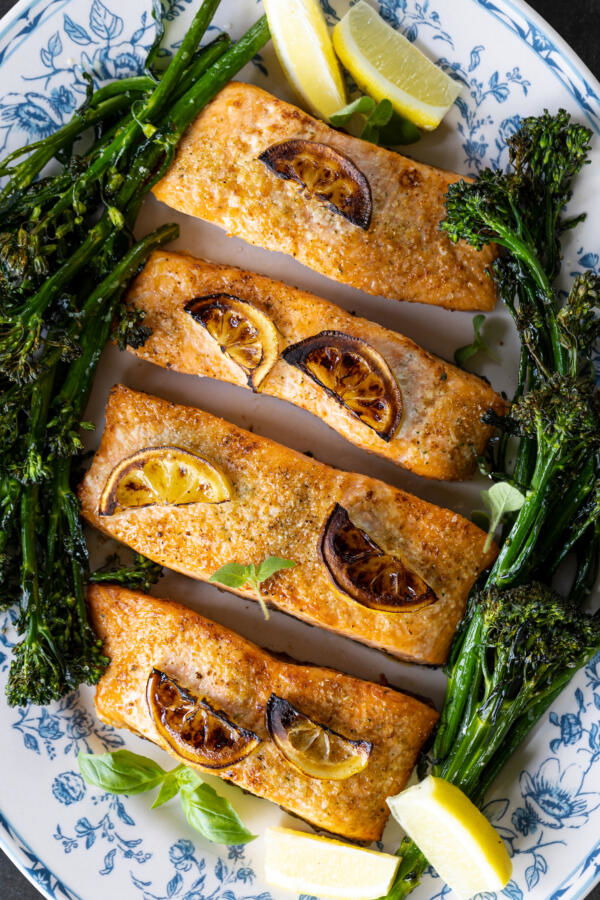 Salmon on a plate with broccolini.