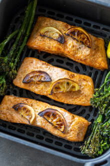 Air Fryer salmon with skin cooked in air fryer basket.