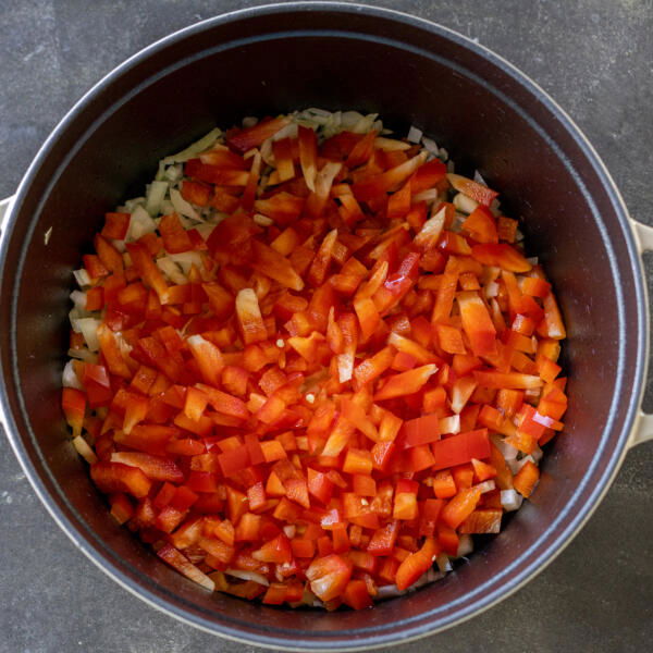 Veggies in a pan cooking.