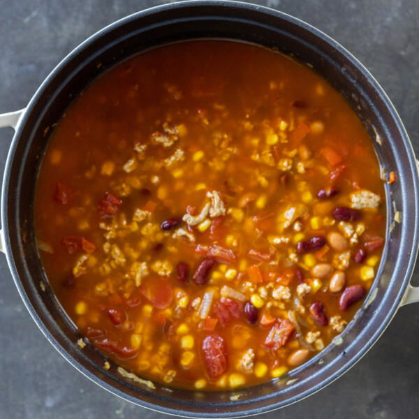 Turkey chili simmering in a pot.