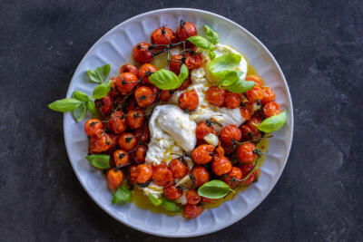 Plated Braised Tomatoes with Burrata.
