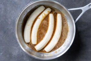 Bananas with sauce in a pan.