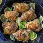 Greek Lemon Chicken plated with lemon and herbs.