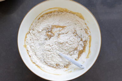 Dry ingredients added to the bowl with all the liquids.