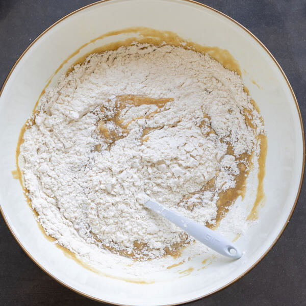 Dry ingredients added to the bowl with all the liquids.