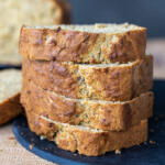 Sliced up banana bread on a tray.