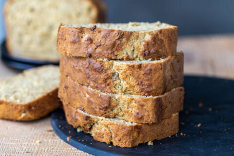 Sliced up banana bread on a tray.