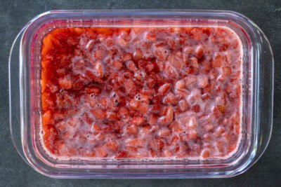 Cooked strawberries in a tray.
