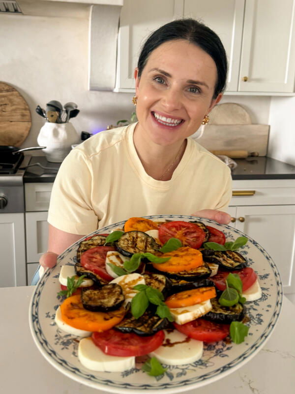 Natalya with Eggplant Caprese in her hands.