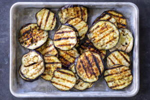 Grilled eggplant on a baking sheet.