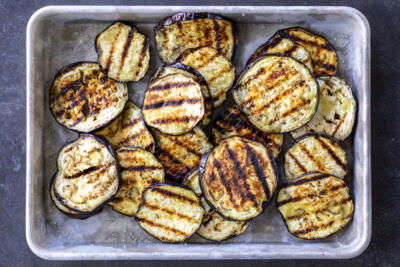 Grilled eggplant on a baking sheet.