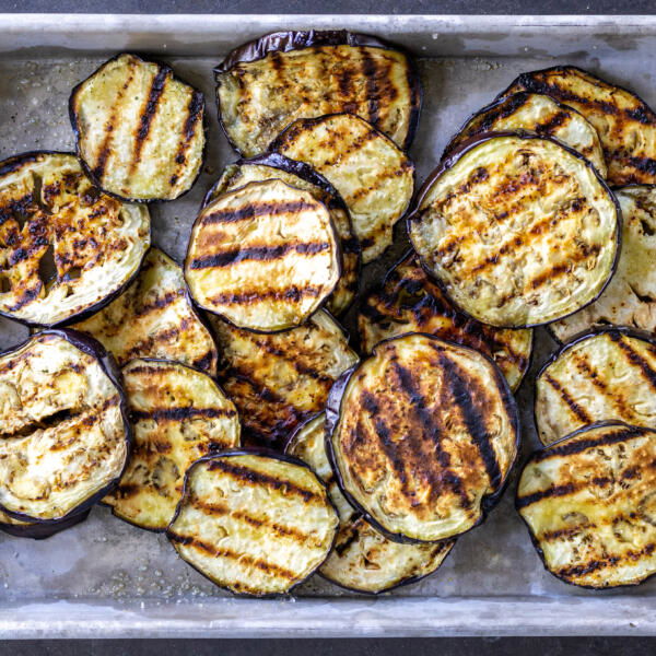 Grilled eggplant on a baking sheet.
