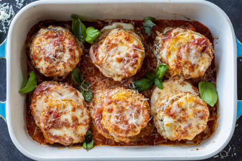 Baked Eggplant Parmesan in a pan.