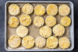 Crusted eggplant on a baking sheet.