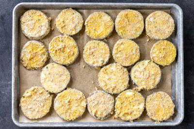 Crusted eggplant on a baking sheet.