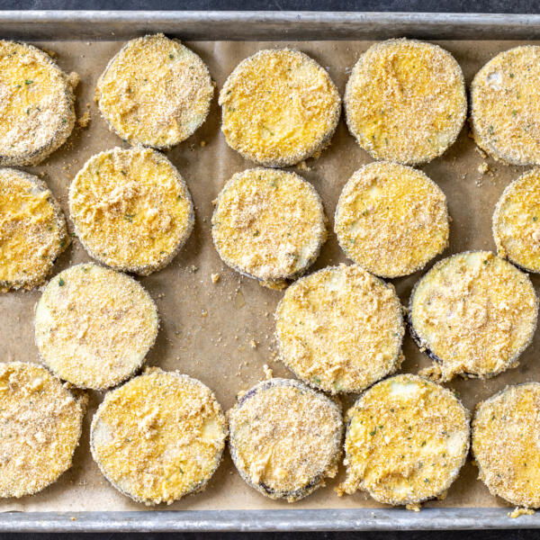 Crusted eggplant on a baking sheet.