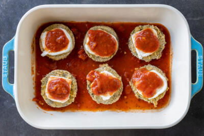 Pan with marinara, crusted eggplant, Mozarella and marinara on top