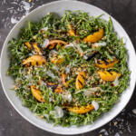 Peach Arugula Salad in a bowl.