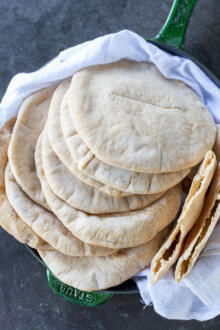 A pile of Sourdough pita in a pan.