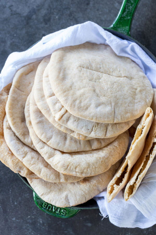 A pile of Sourdough pita in a pan.