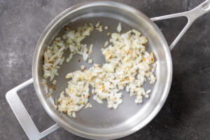 Onions frying in a pan.