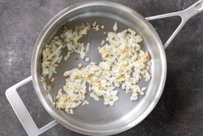 Onions frying in a pan.