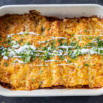 Baked Chicken Enchiladas in a baking dish.