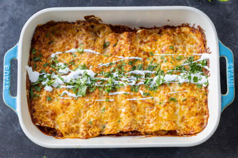 Baked Chicken Enchiladas in a baking dish.