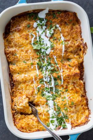 Baked Chicken Enchiladas in a pan.