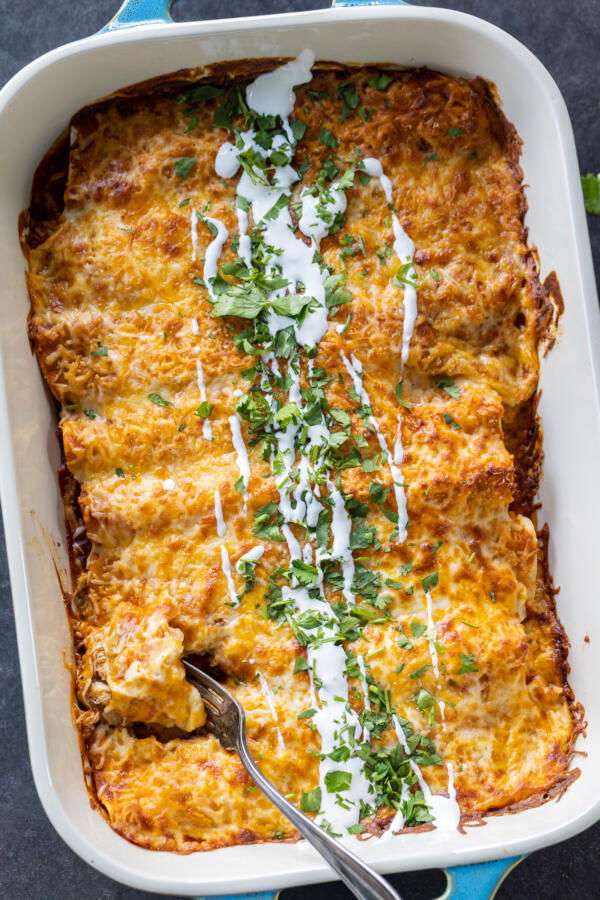 Baked Chicken Enchiladas in a pan.