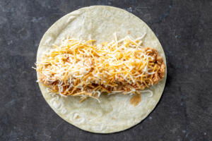 Tortilla with chicken and cheese.
