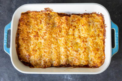 Baked Chicken Enchiladas in a pan.