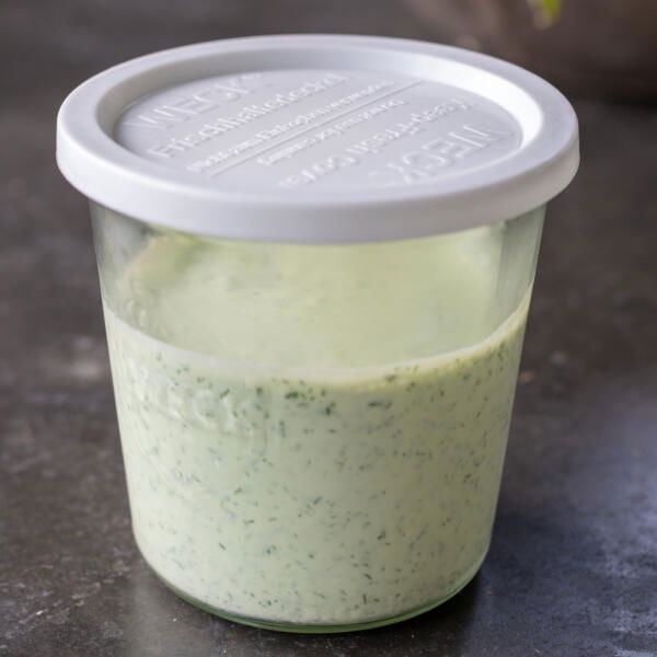 Green Goddess Dressing in a storage contianer.