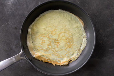 Cooked crepe in a pan.