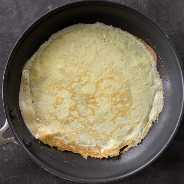 Cooked crepe in a pan.
