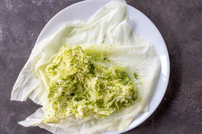 Grated zucchini on a plate.