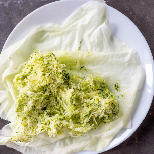 Grated zucchini on a plate.